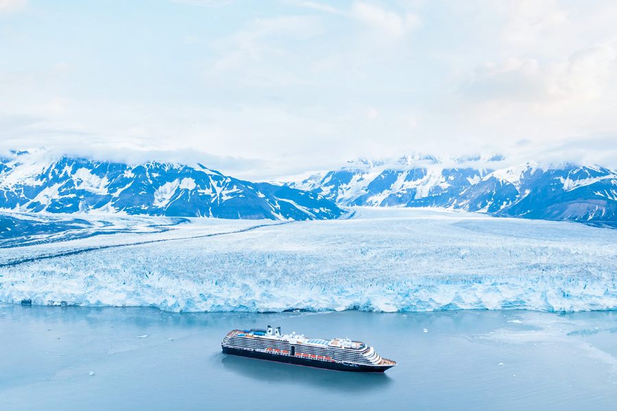A Holland America Line ship before an Alaskan glacier