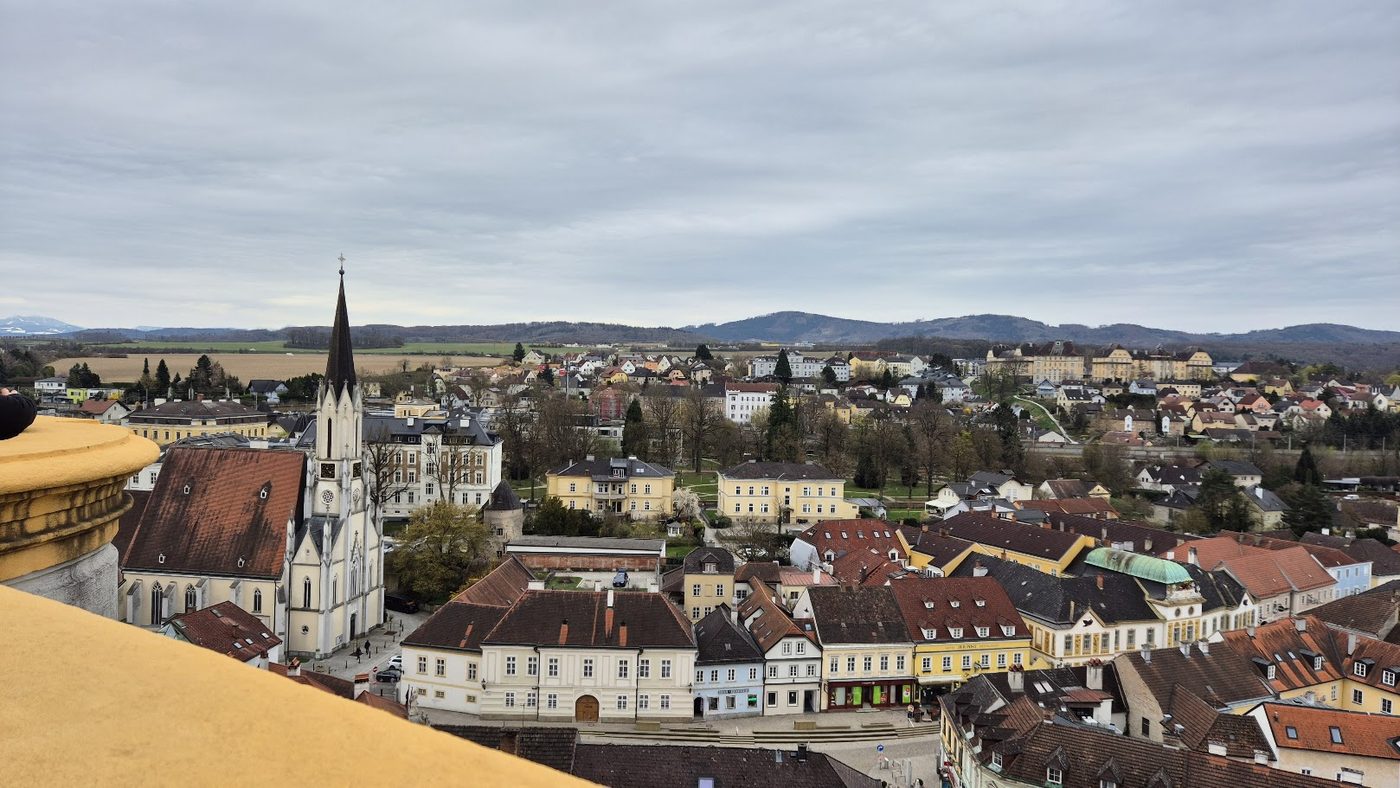 The rooftops and church spire of Melk seen from the abbey terrace