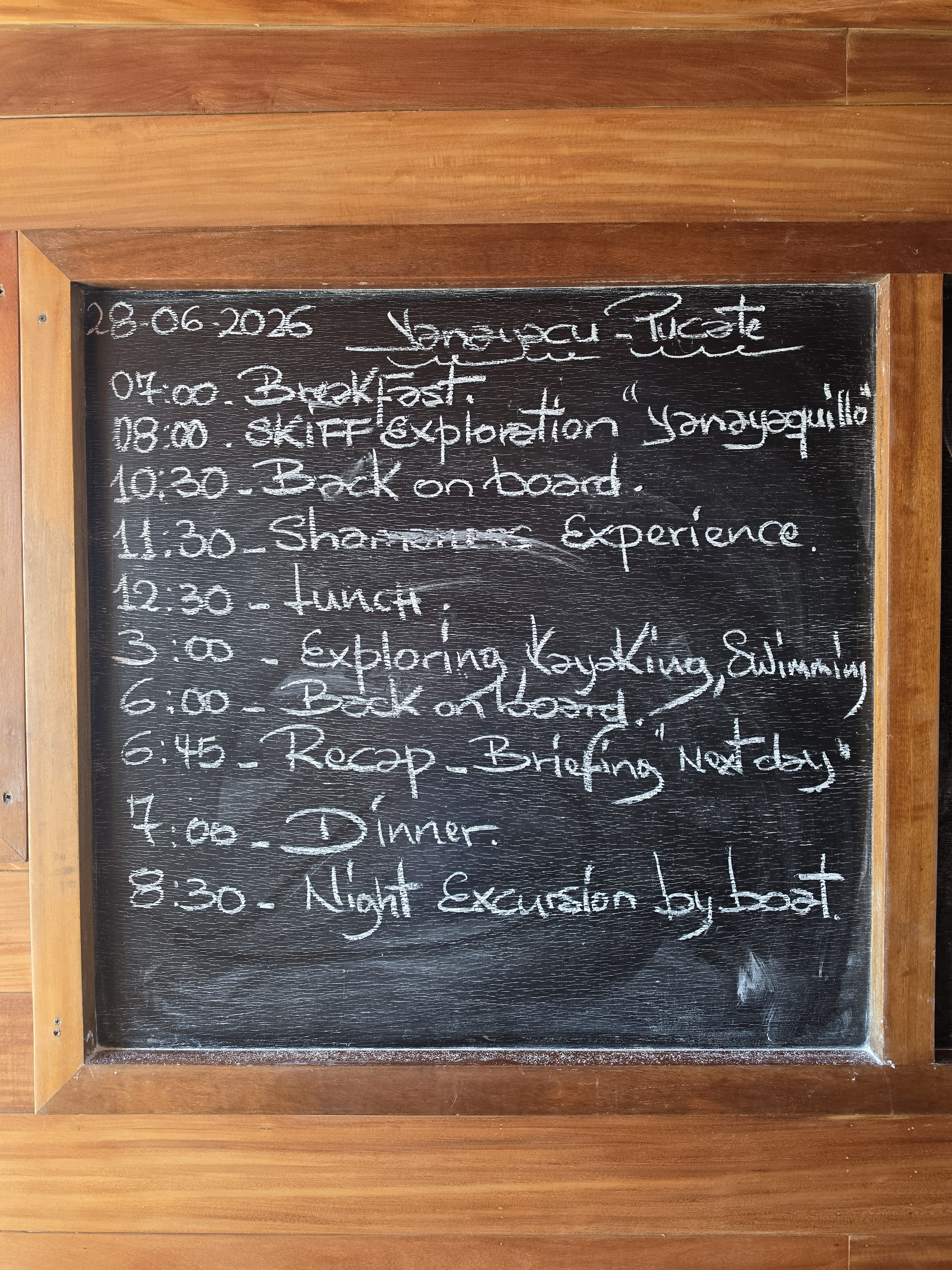 The chalkboard programme for 28 June 2026 on Delfin III: skiff exploration, a shaman session, kayaking, swimming and a night excursion