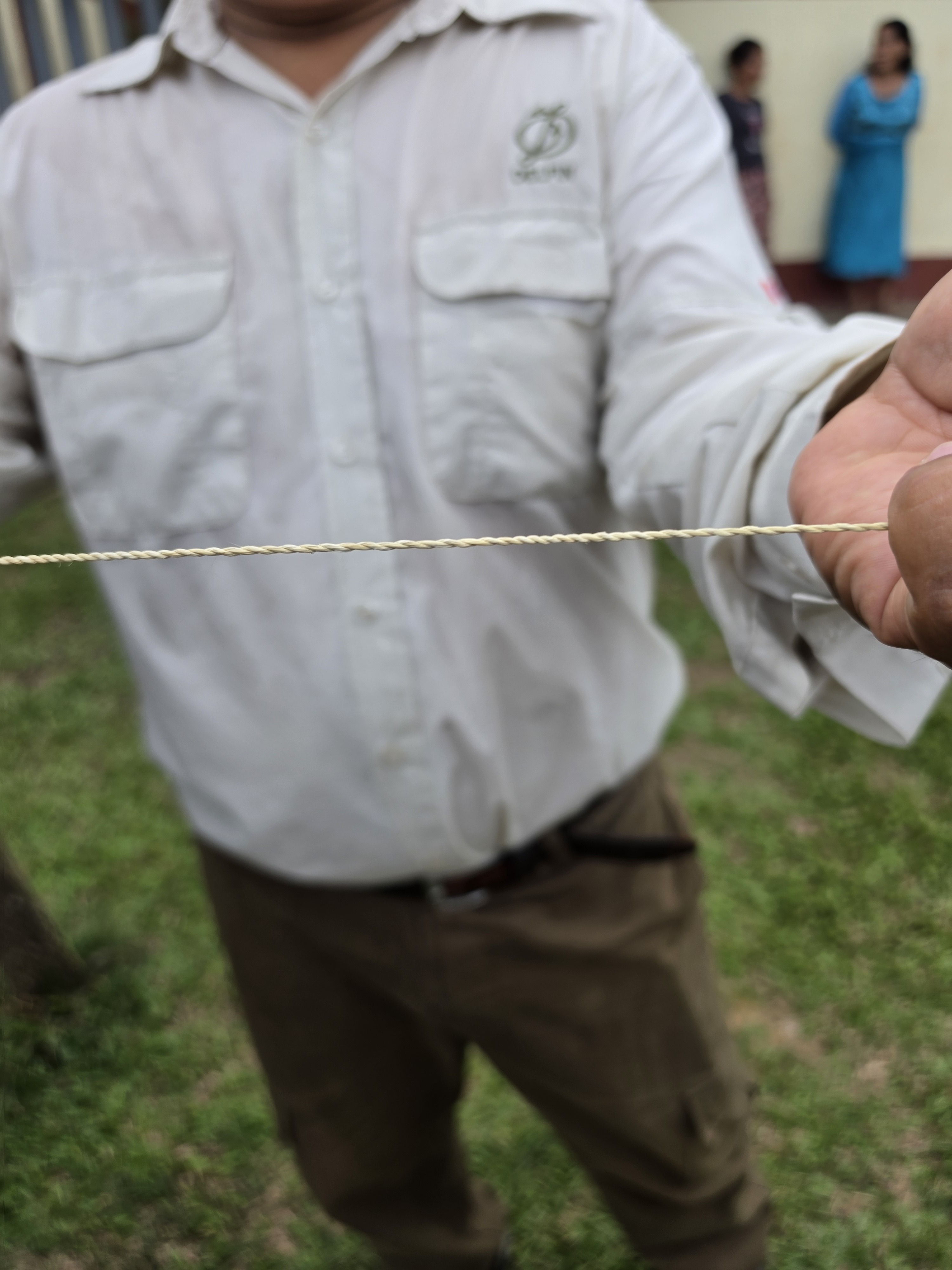 Hand-spun chambira palm cordage held up during a village visit in the Peruvian Amazon